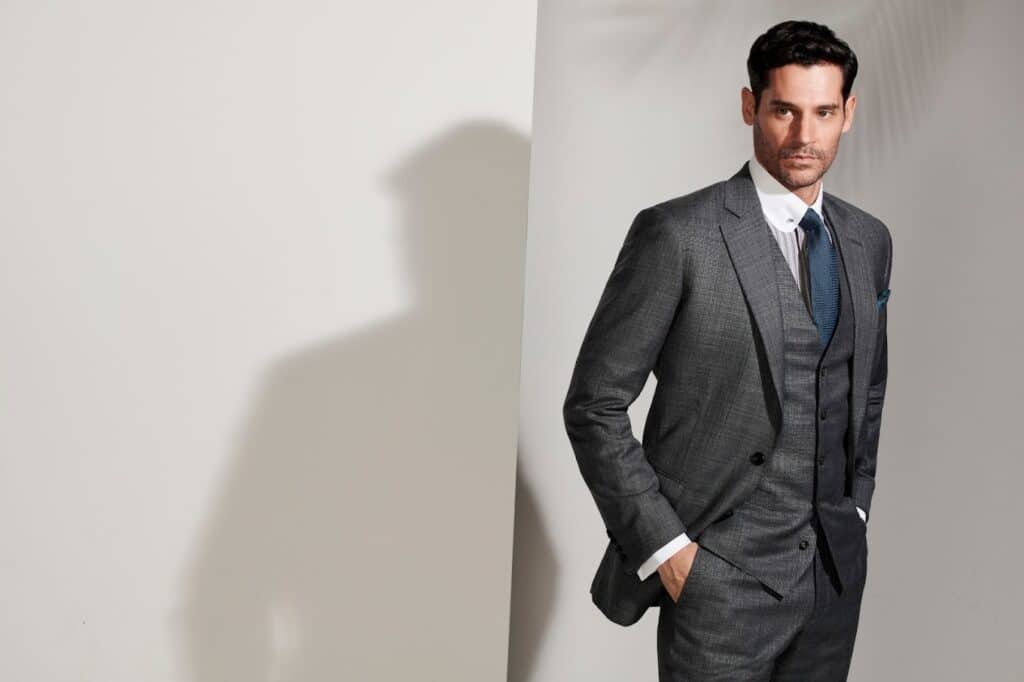 Man in a dark grey custom suit