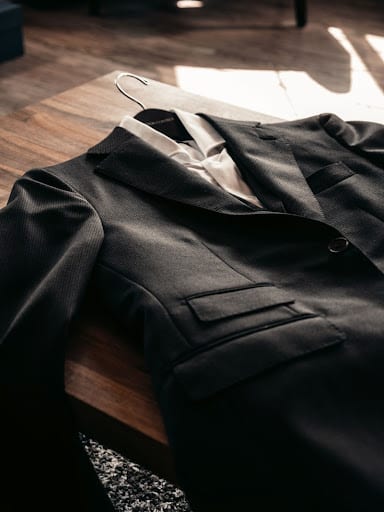 Black custom suit on a table
