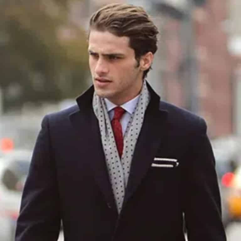 Client wearing single breasted bespoke overcoat.