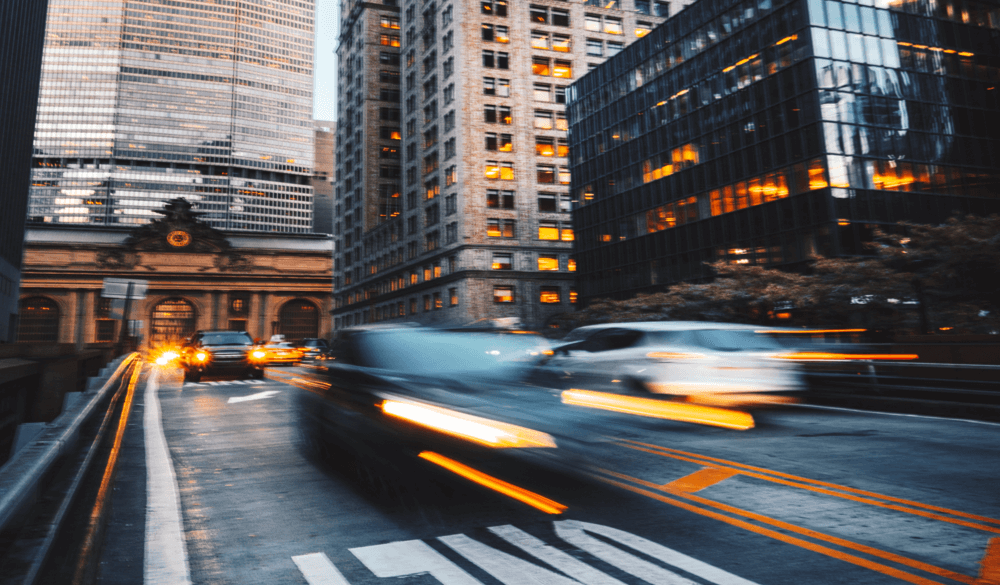Car speeding thru Upper Manhattan highway