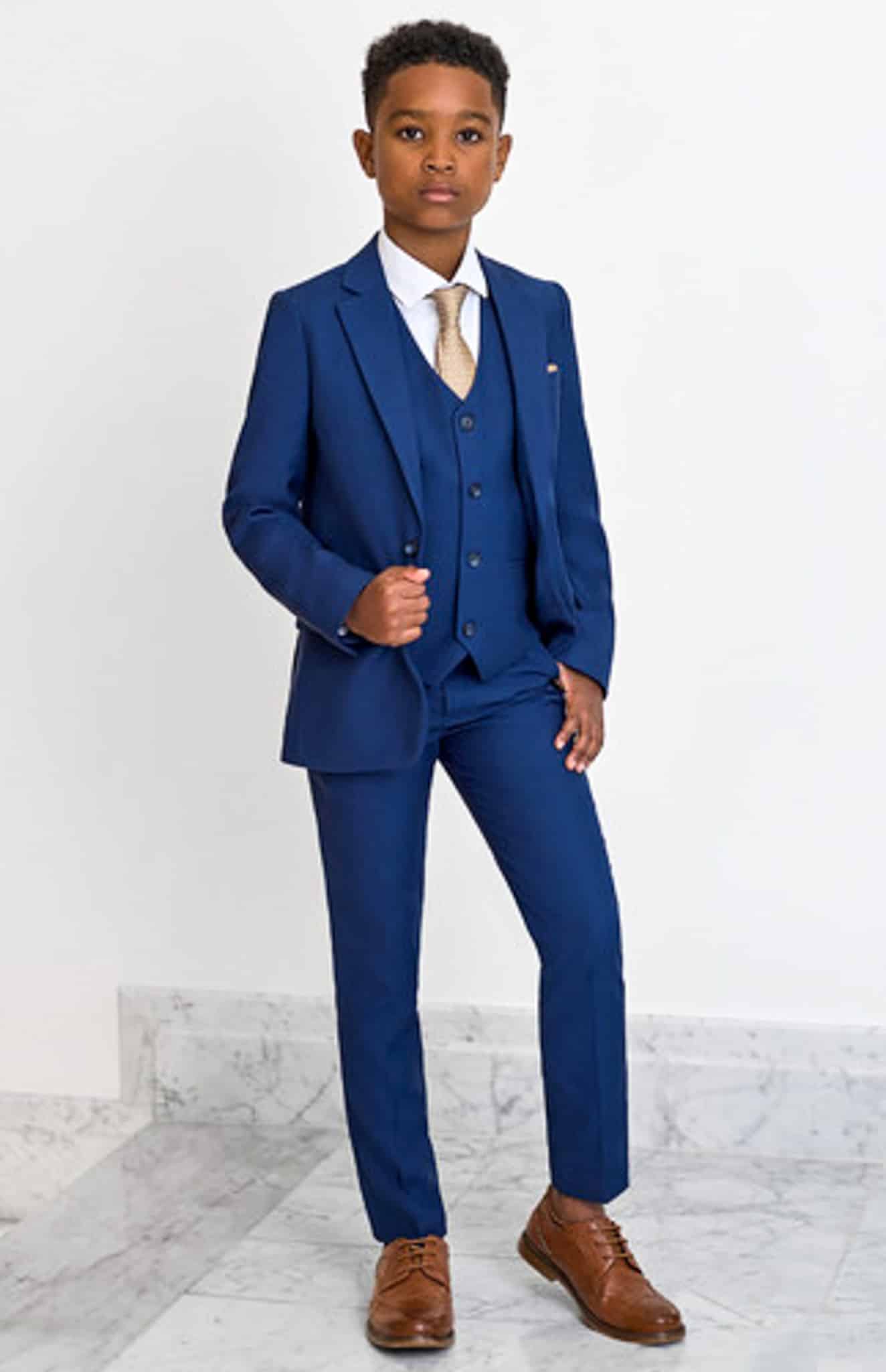 Boy in navy blue Loro Piana vested custom made suit.