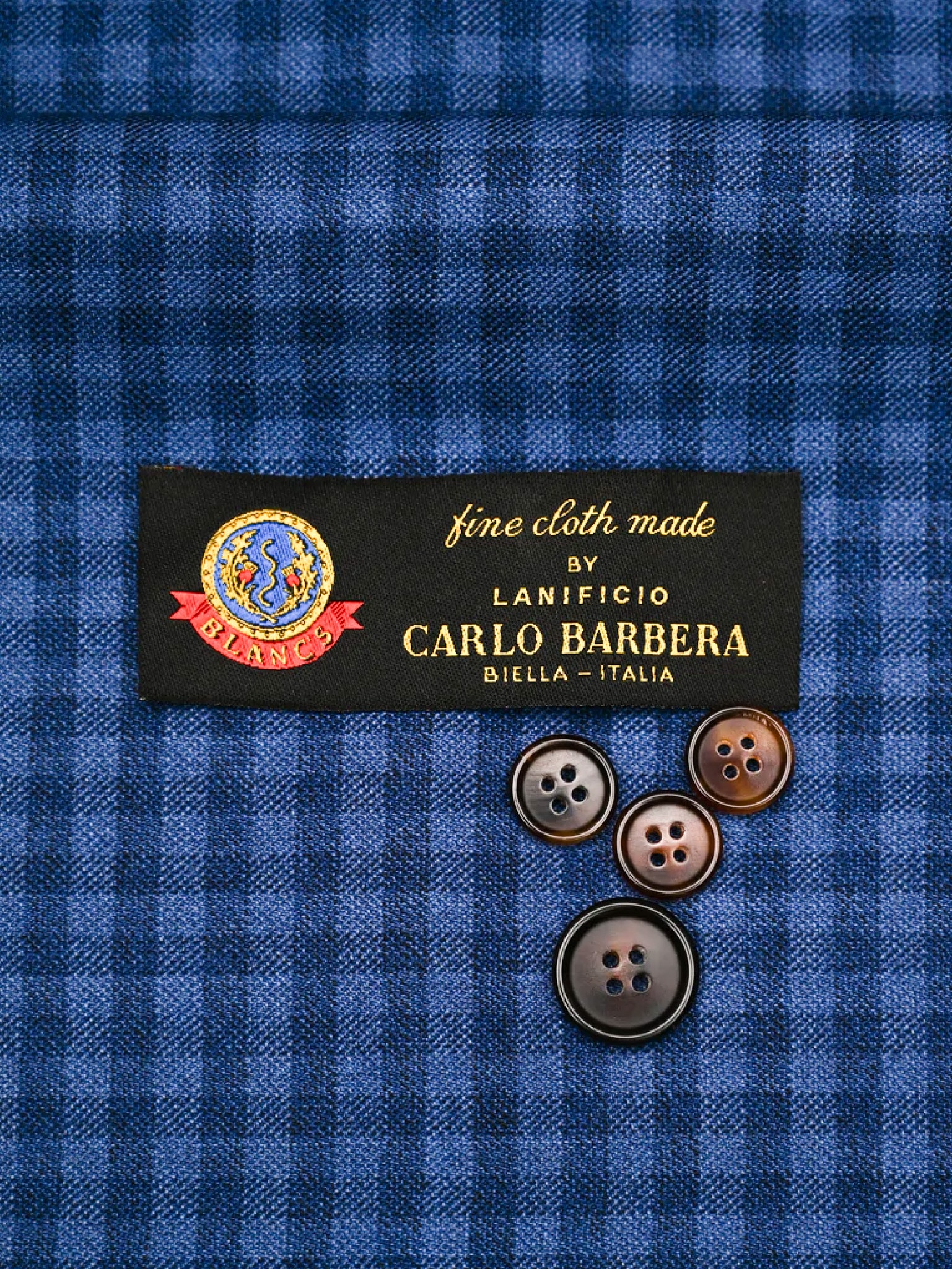Carlo Barbera blue and navy check fabric swatch.