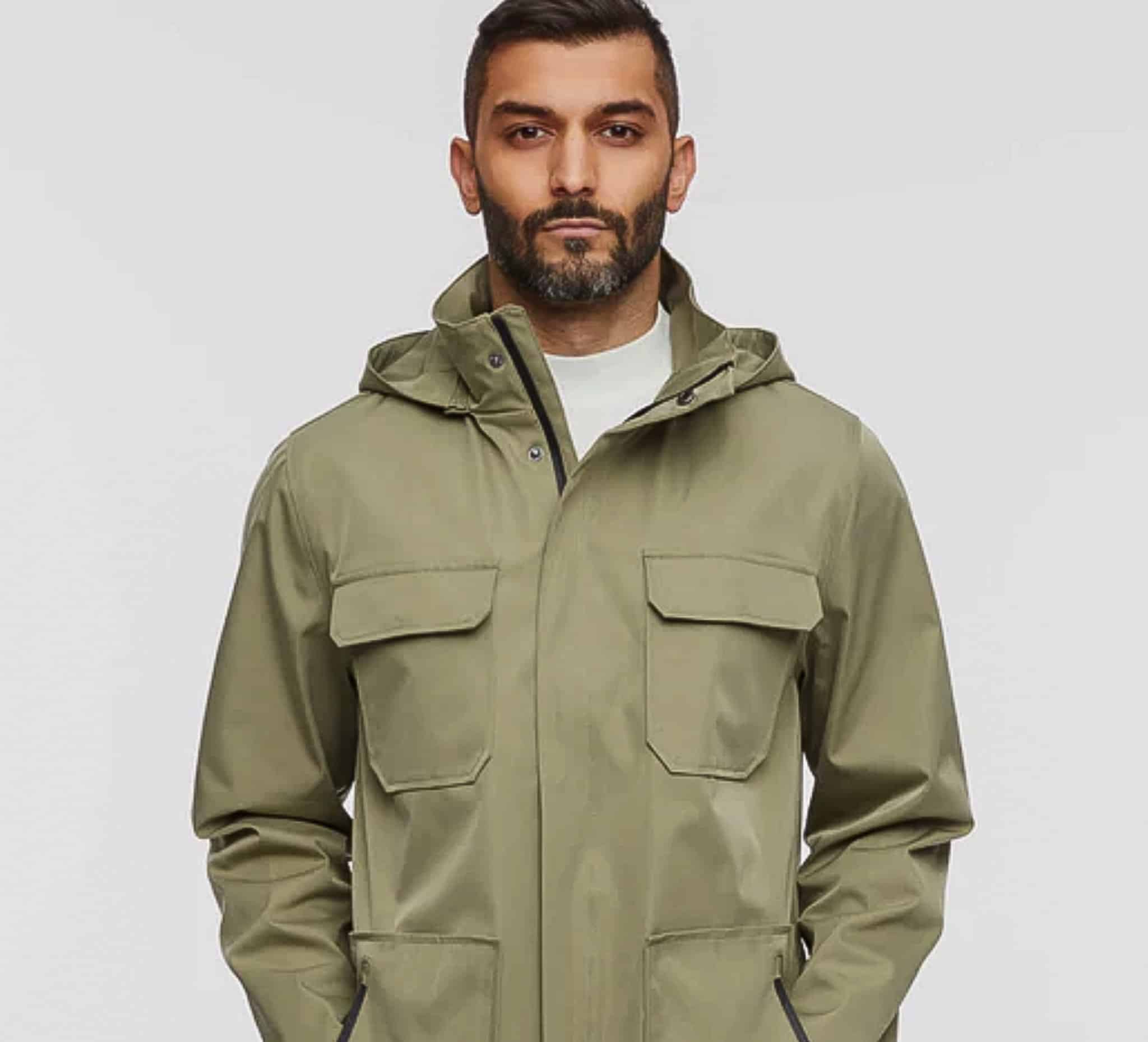 Client in light green casual custom raincoat.