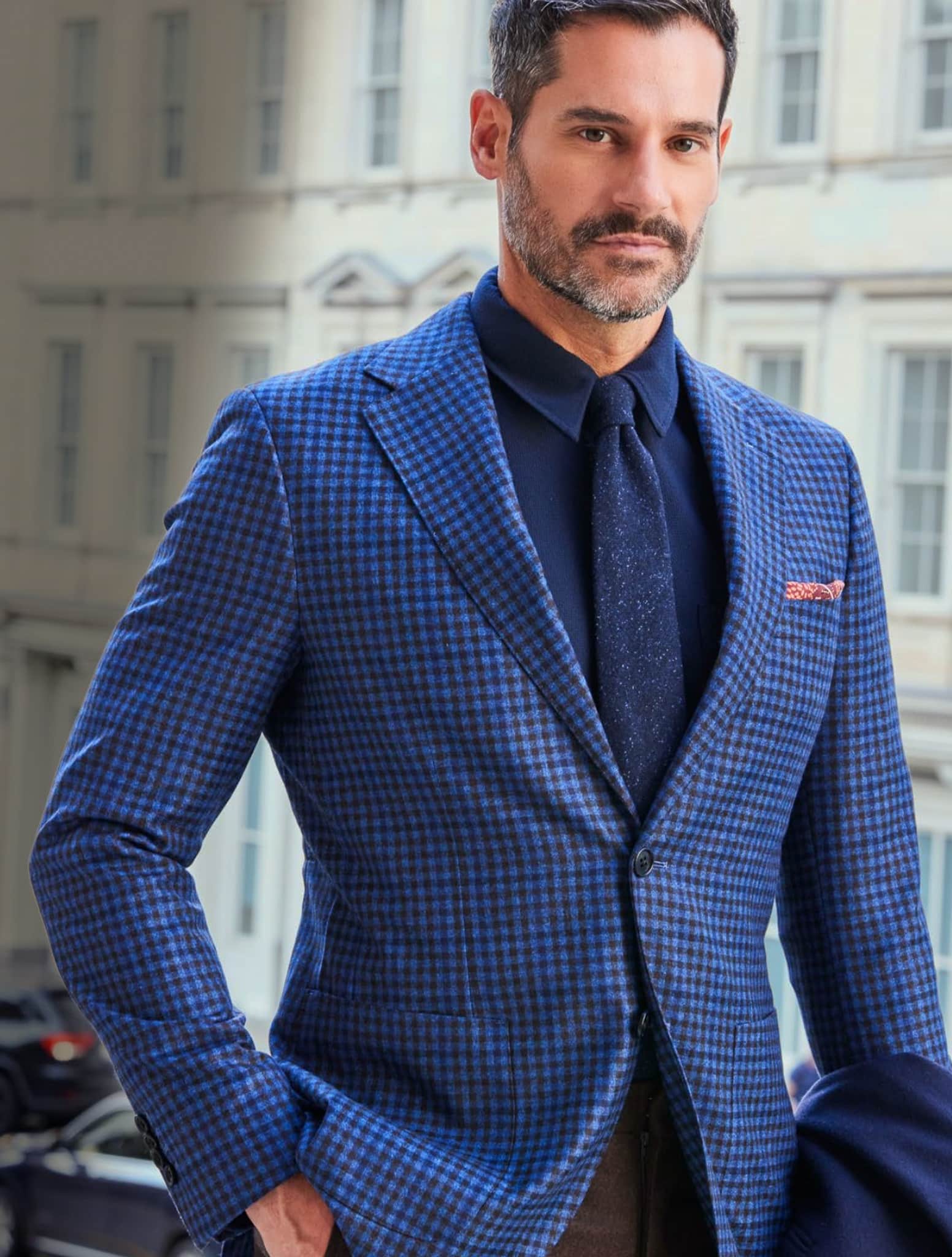 Client in blue and navy check Loro Piana bespoke sportscoat with ink navy dress shirt and navy blue long tie.