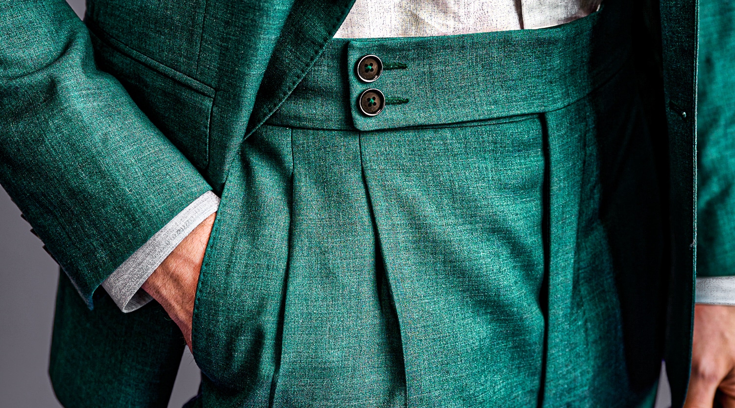 Loro Piana green custom made trousers with 2 inch waistband extended 2 button closure.