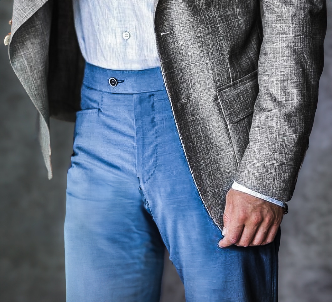 Client in light blue solid custom trousers. Faric by Ermenegildo Zegna