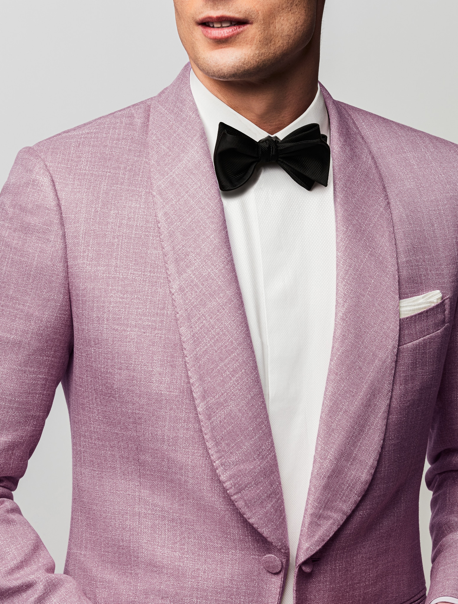 Pink custom tuxedo with shawl lapel, white custom shirt and black bowtie.