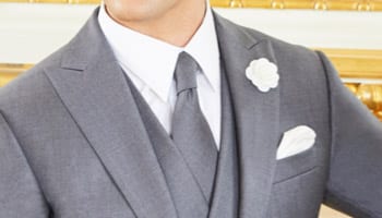 Grey bespoke morning coat with matching vest white shirt and grey long tie. Fabric by Ermenegildo Zegna.