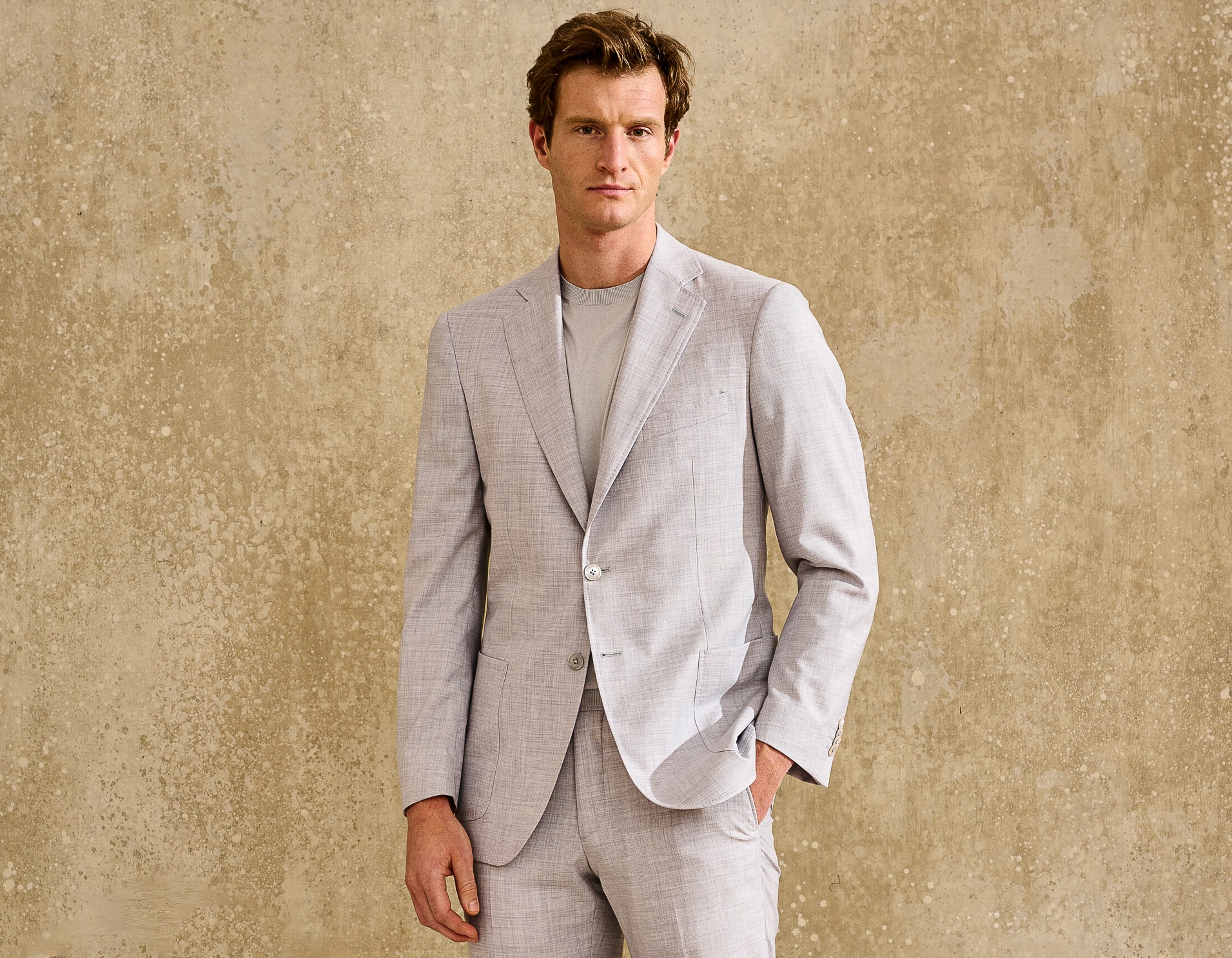 Model wearing Scabal bespoke off white linen suit with off white crew t-shirt