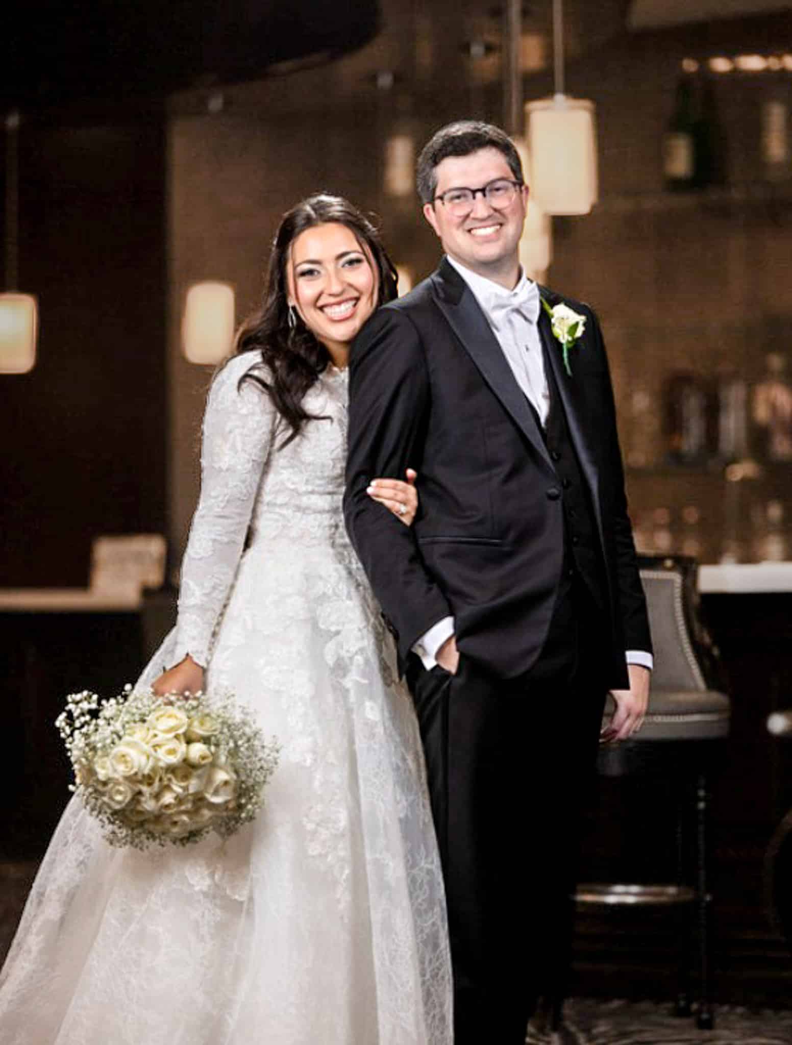 Son and daughter in law of owner Alan David Horowitz. Groom wearing classic custom tailored black tuxedo with vest.