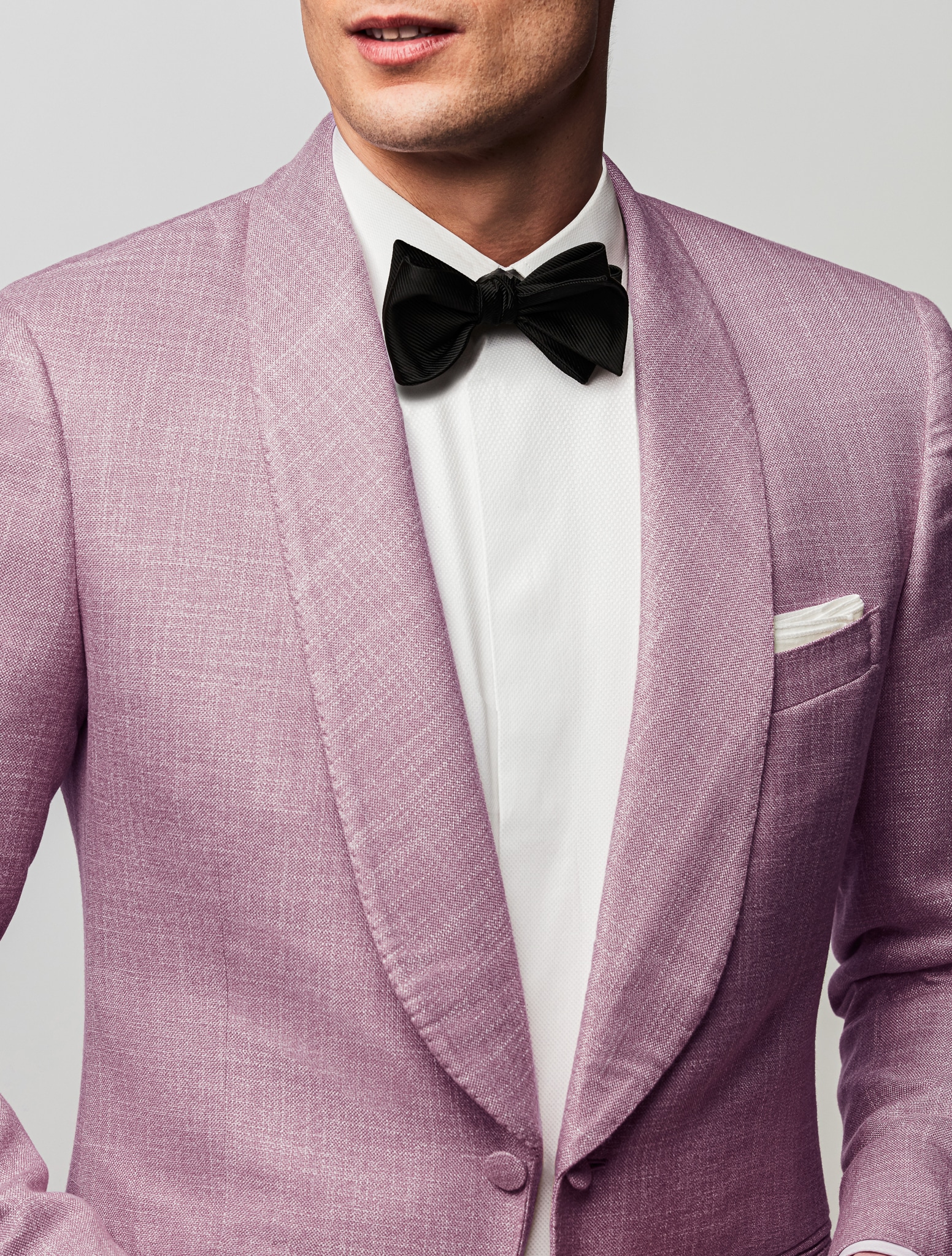 Groom in pink bespoke dinner jacket with shawl lapel.